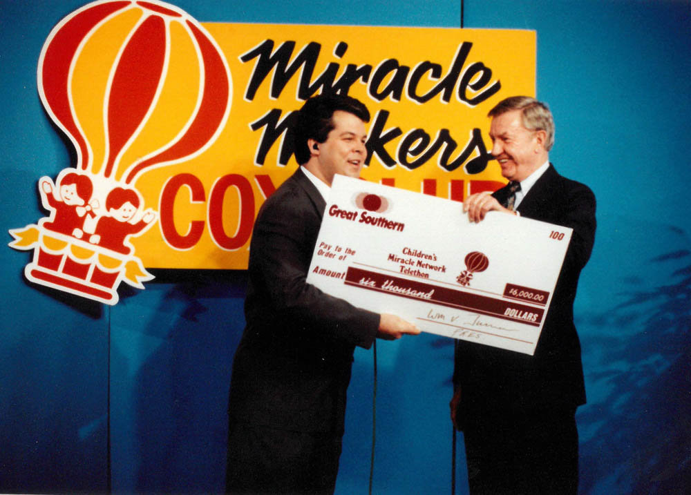 Known for his philanthropy, Bill Turner, right, presents a $6,000 bank donation to KY3’s Steve Grant during a Children’s Miracle Network Telethon in the early 1990s.